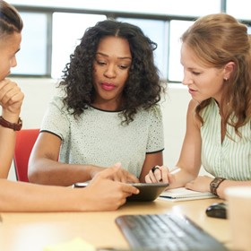 Teachers collaborate in a classroom