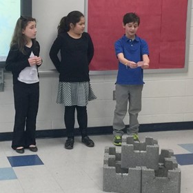 Students work on oyster castle project.