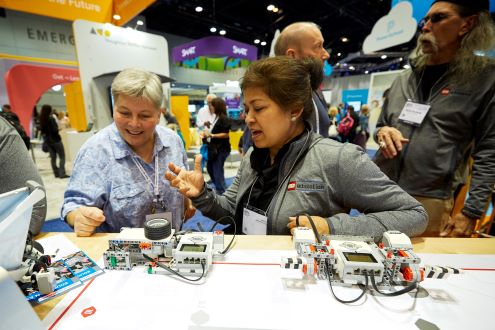 Two women explore the expo hall at the ISTE Conference & Expo