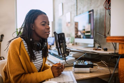 A teacher recording a podcast