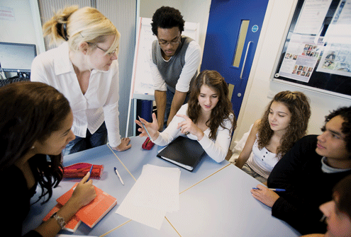 Students around a table collborating