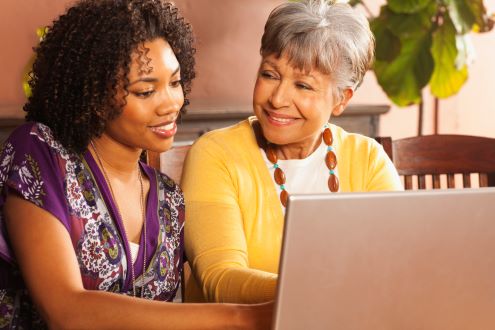An educator talks to a parent about the benefits of technology