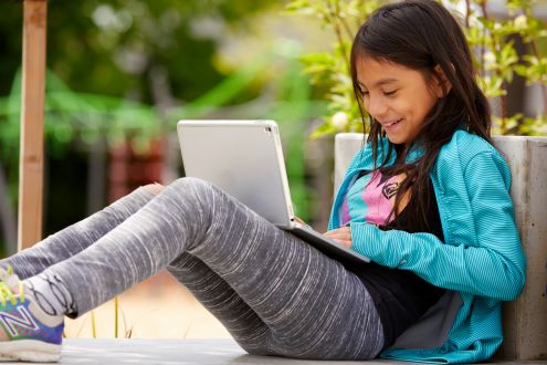 A student does school work on a Chromebook