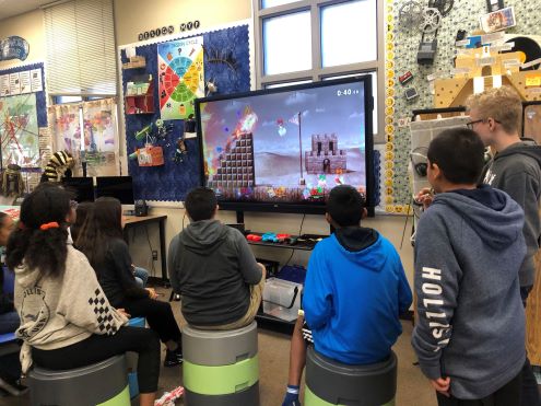 Students play video game in school
