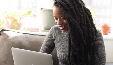an educator working on a laptop