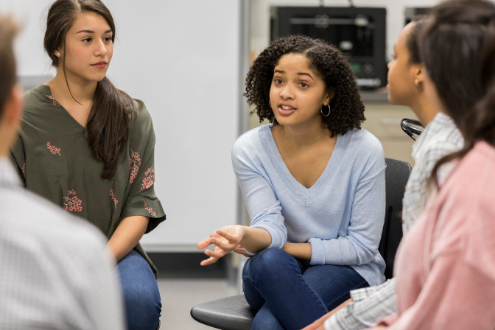 Students in a classroom discuss controversial topics