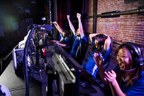students celebrating an esports win