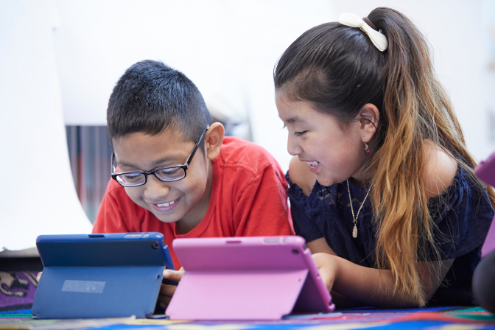 Two students with iPads in school