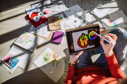 a person creates a digital drawing on an ipad